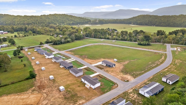 aerial view featuring a rural view and a mountain view