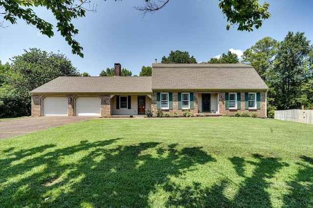 ranch-style home with a front yard and a garage