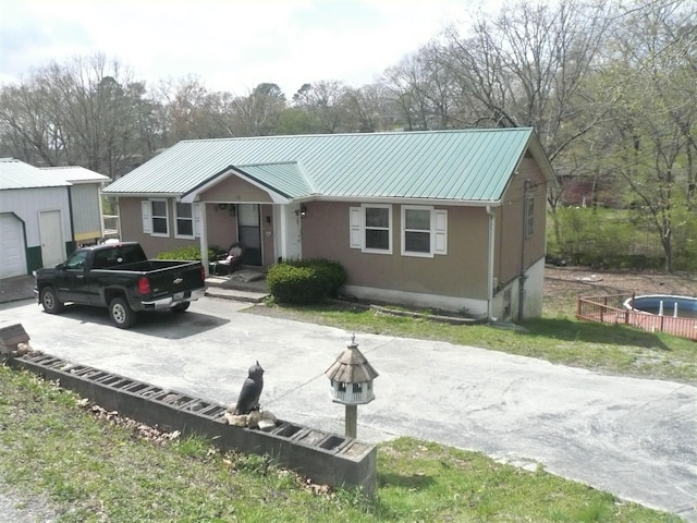 view of front facade with an outdoor structure and a garage