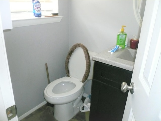 bathroom with toilet and vanity