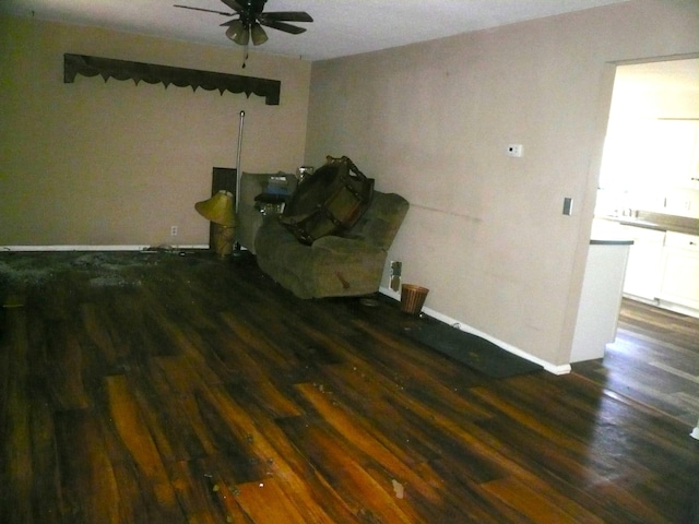 interior space featuring ceiling fan and dark hardwood / wood-style flooring