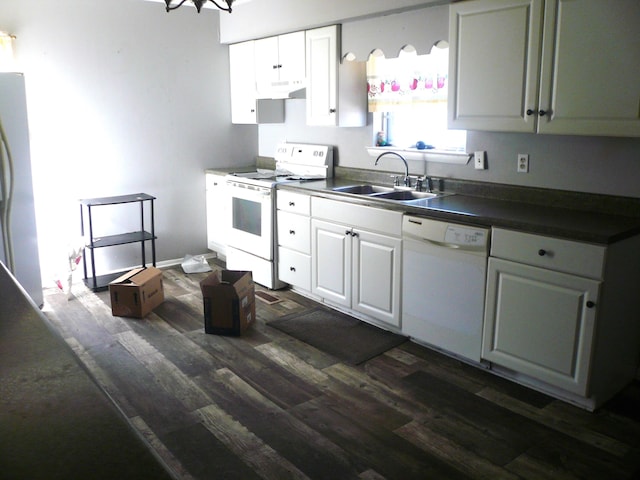 kitchen featuring white cabinets, white appliances, dark hardwood / wood-style floors, and sink