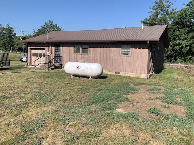 view of side of property with a yard