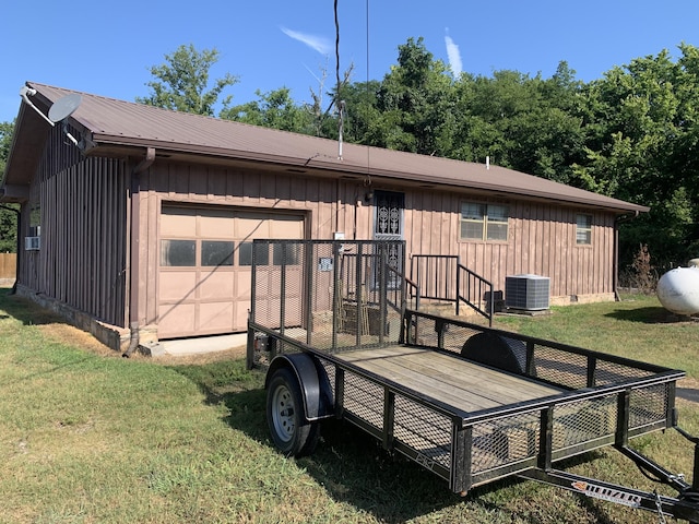 exterior space with a yard and central AC unit