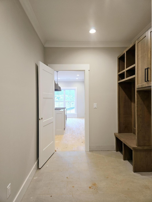 mudroom featuring crown molding