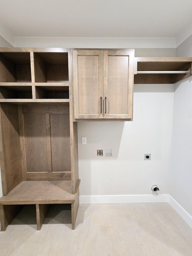 laundry room with cabinets and electric dryer hookup