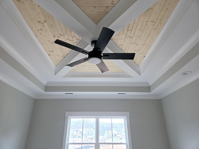 details with wood ceiling, ornamental molding, and a raised ceiling