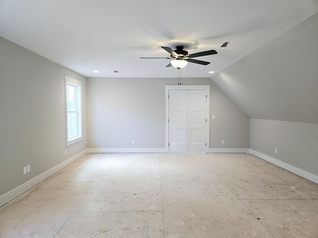 additional living space with ceiling fan and lofted ceiling