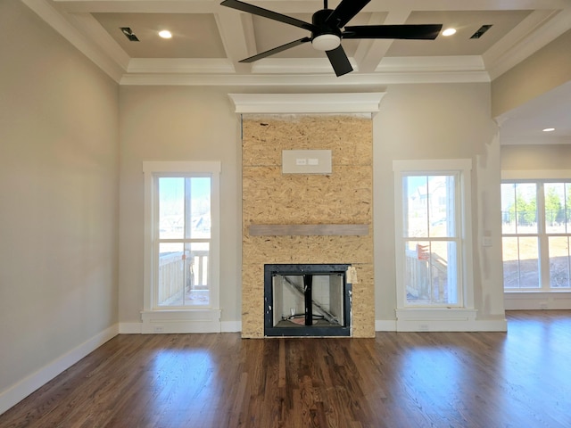 unfurnished living room featuring coffered ceiling, a large fireplace, and dark hardwood / wood-style floors