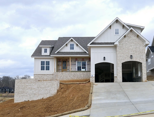 view of front of house featuring a garage and covered porch