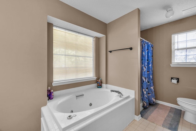 bathroom featuring a textured ceiling, separate shower and tub, and toilet