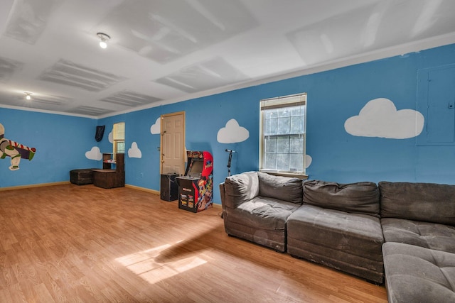 living room with crown molding and light hardwood / wood-style flooring