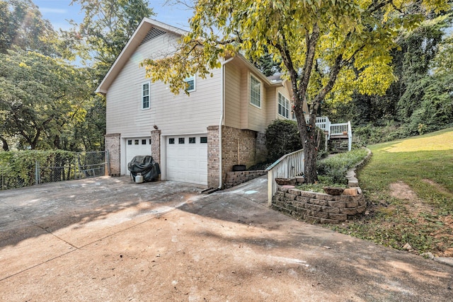 view of property exterior featuring a garage