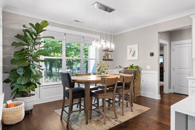 dining space with a chandelier, dark hardwood / wood-style flooring, and crown molding