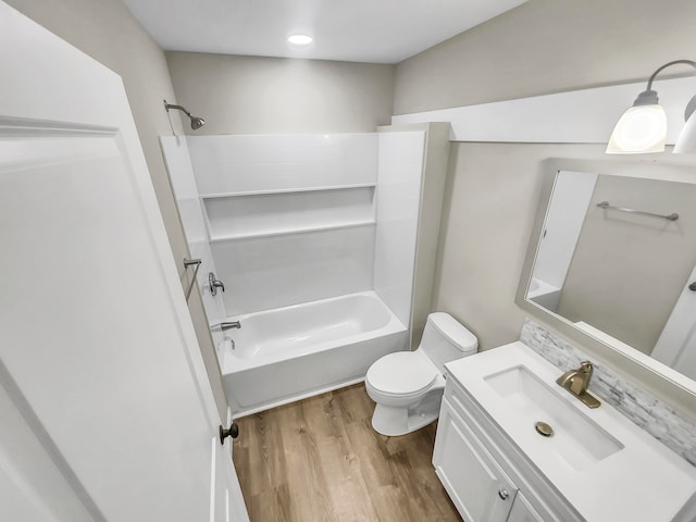 full bathroom with vanity, toilet, shower / tub combination, and hardwood / wood-style flooring