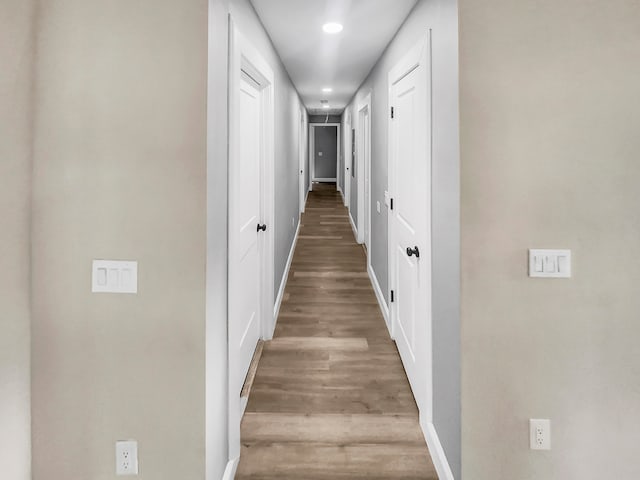 corridor with light wood-type flooring