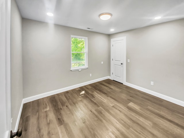 spare room featuring hardwood / wood-style floors