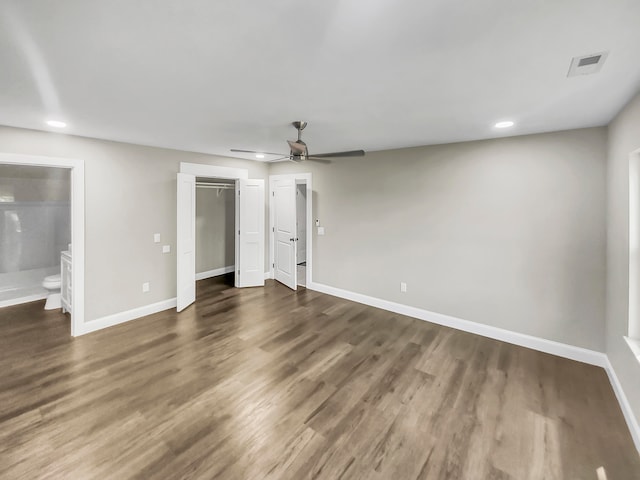 interior space with ceiling fan and dark hardwood / wood-style floors