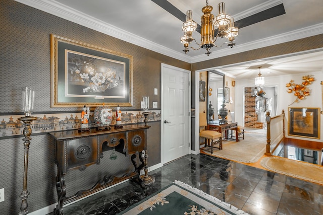 entrance foyer featuring a chandelier, crown molding, baseboards, marble finish floor, and wallpapered walls