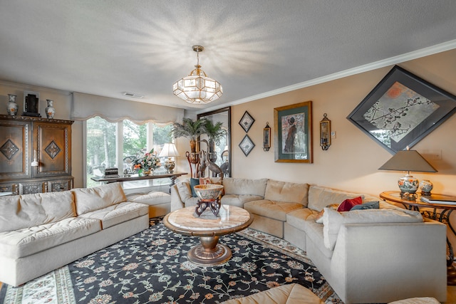 living room with crown molding and a textured ceiling