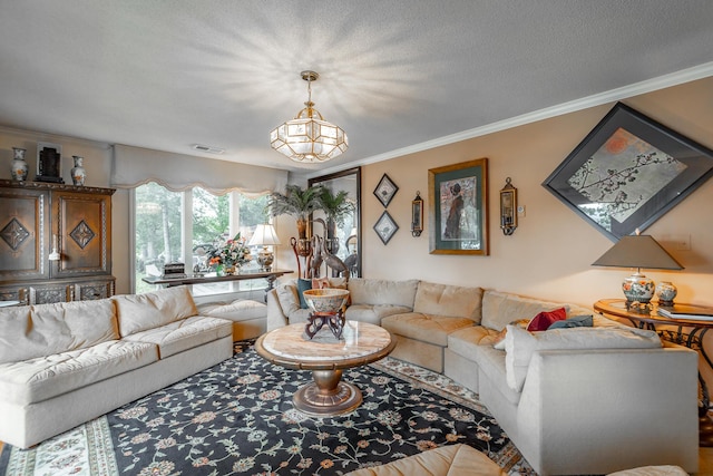 living room with visible vents, ornamental molding, and a textured ceiling