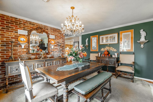 carpeted dining space with crown molding, brick wall, a chandelier, and baseboards