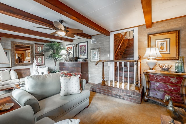 living room featuring ceiling fan, carpet, and beam ceiling