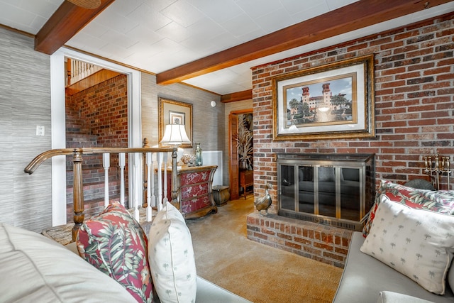 living area with beamed ceiling, carpet flooring, and a brick fireplace