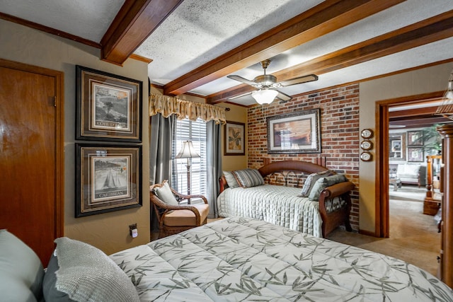 bedroom featuring beam ceiling, carpet floors, a ceiling fan, a textured ceiling, and brick wall