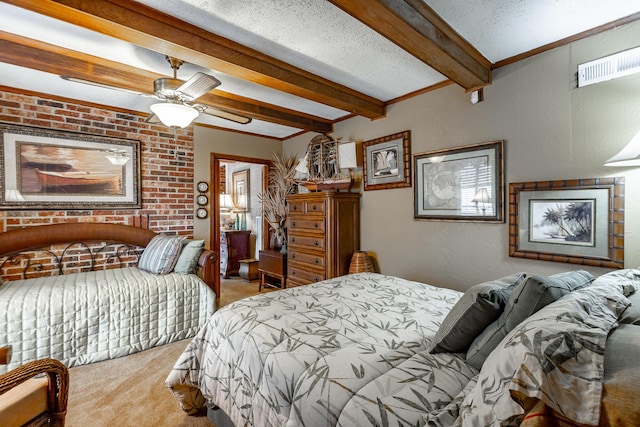 carpeted bedroom featuring beam ceiling, a ceiling fan, a textured ceiling, brick wall, and visible vents
