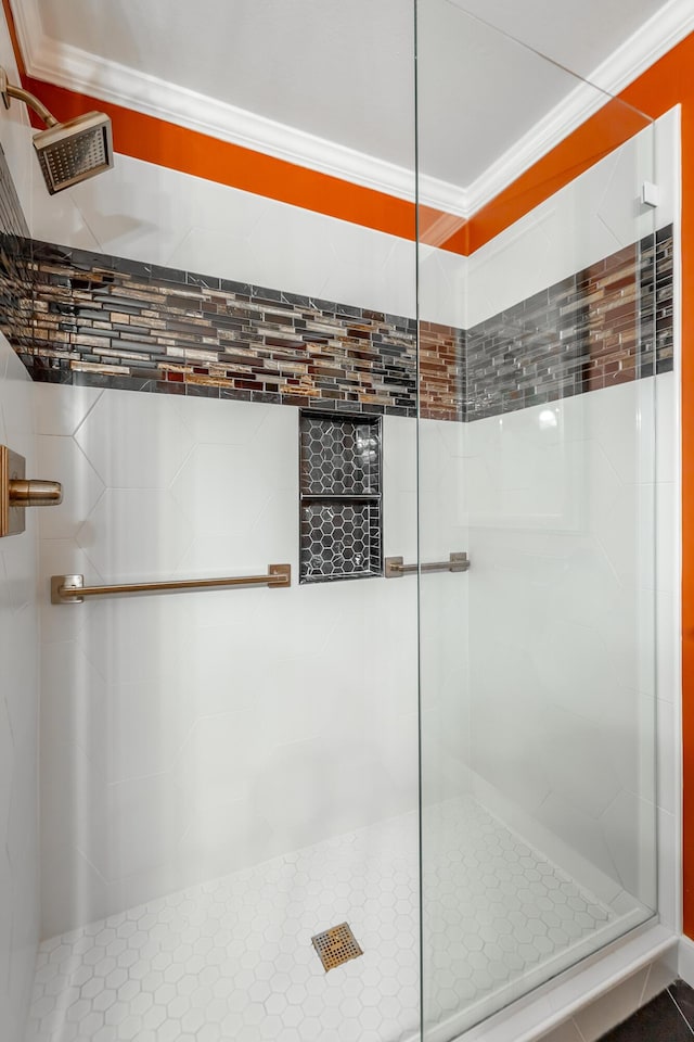 full bath featuring visible vents, a stall shower, and crown molding
