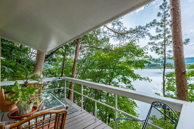 wooden deck with a water view