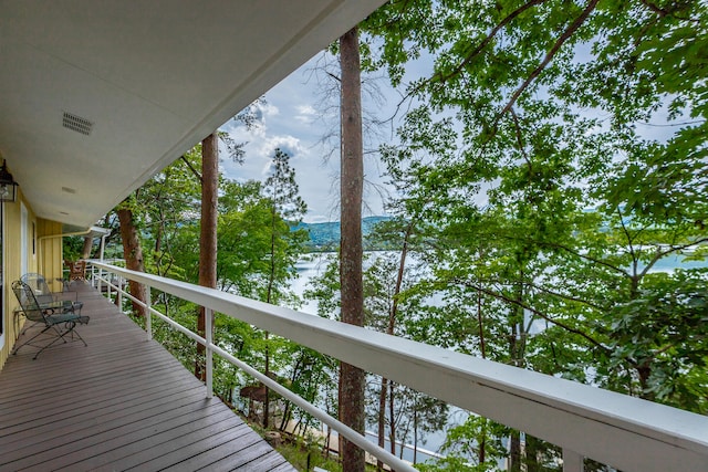 wooden deck with a water view