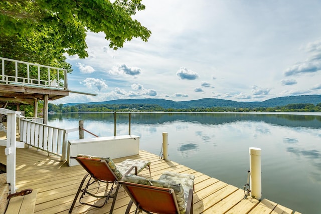 dock area featuring a water and mountain view