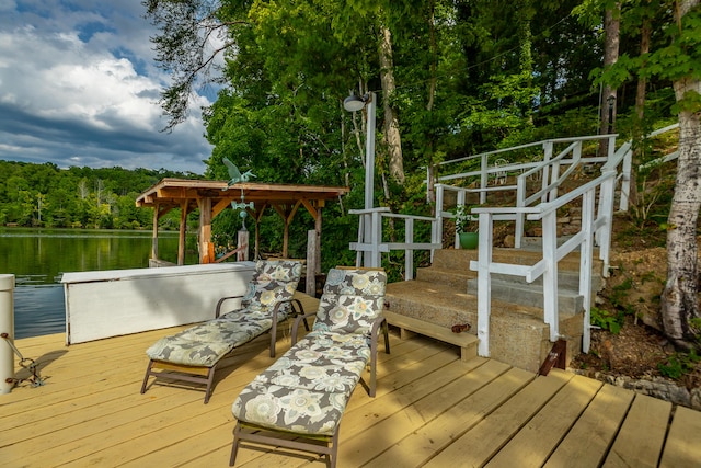 wooden deck with a water view