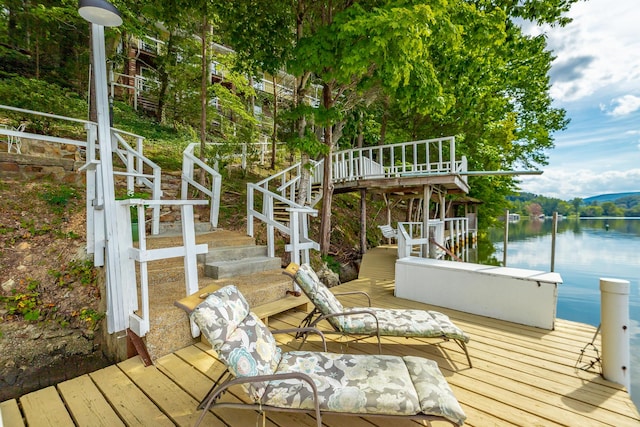 dock area with a water view and stairs
