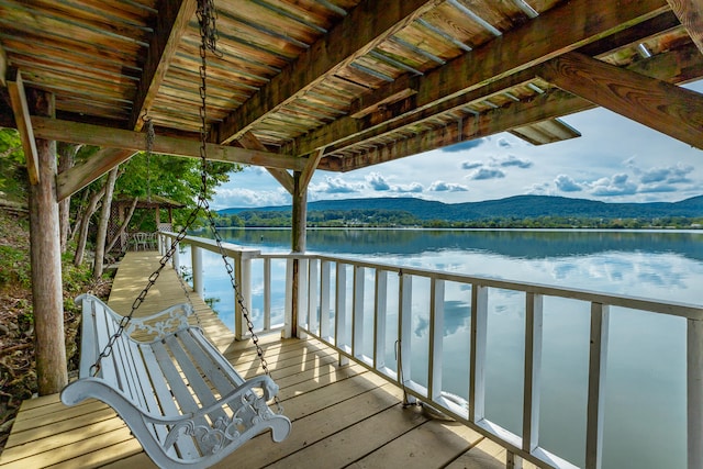 dock area featuring a water and mountain view