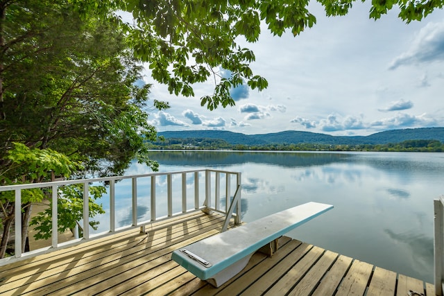 dock area featuring a water and mountain view