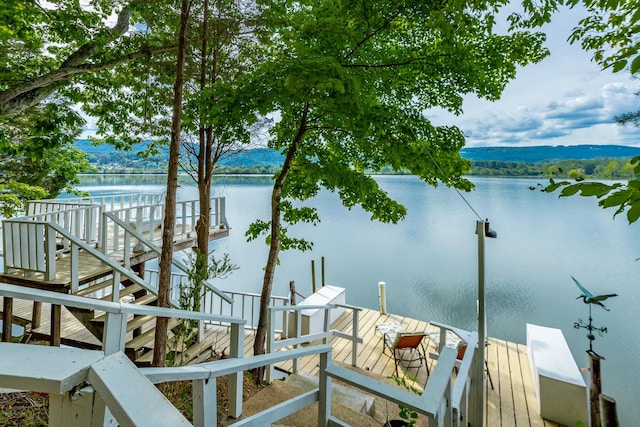 dock area with a water view and stairs