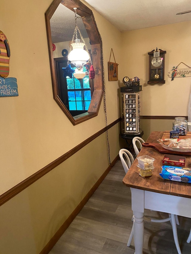 dining area with hardwood / wood-style floors