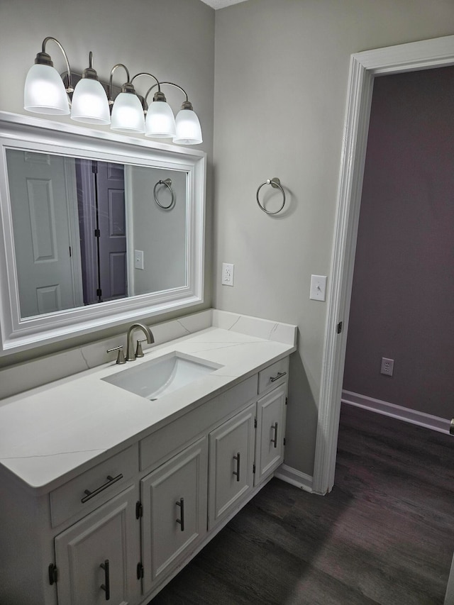 bathroom with vanity and hardwood / wood-style floors