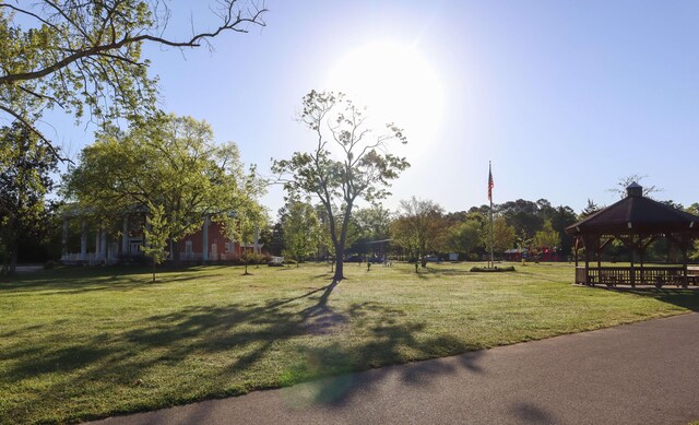 exterior space featuring a yard and a gazebo