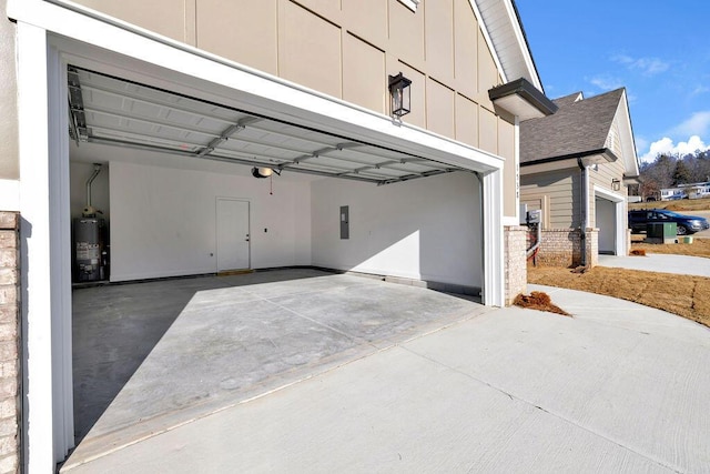 garage featuring gas water heater and electric panel