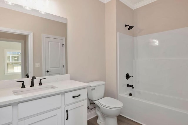 full bathroom featuring toilet, crown molding, shower / bathing tub combination, vanity, and hardwood / wood-style flooring