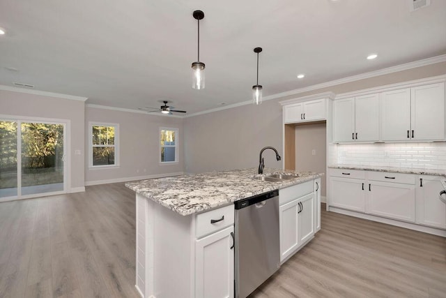 kitchen featuring white cabinetry, sink, stainless steel dishwasher, and a center island with sink