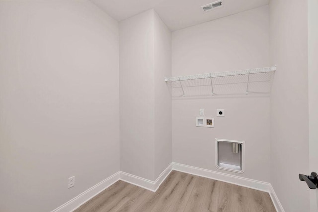 laundry room with washer hookup, hookup for an electric dryer, and light wood-type flooring