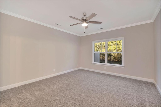 carpeted spare room featuring crown molding and ceiling fan