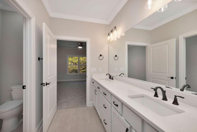 bathroom featuring ceiling fan, tile patterned flooring, vanity, ornamental molding, and toilet