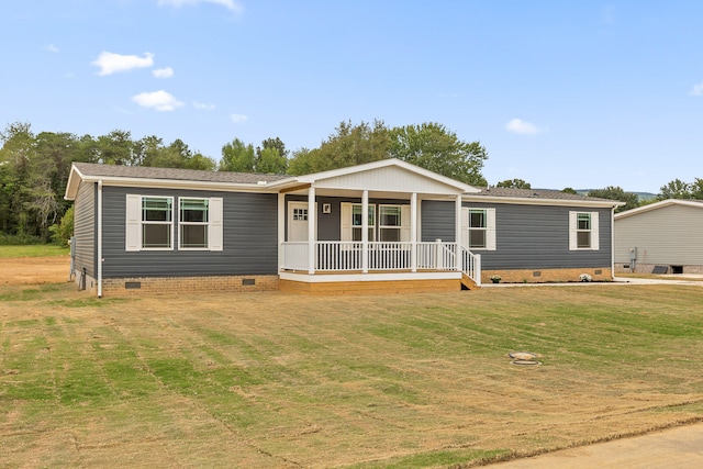 manufactured / mobile home with a porch and a front lawn