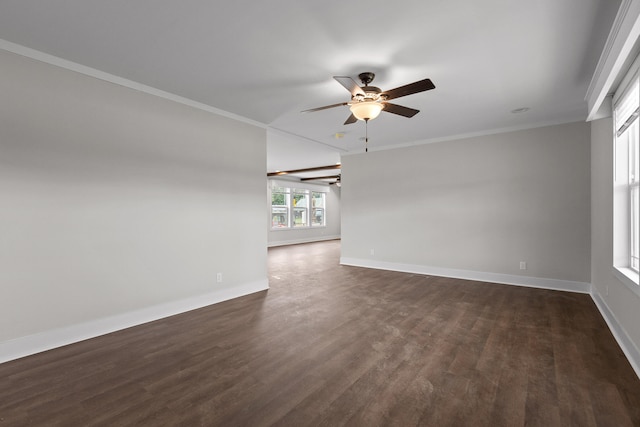 spare room with dark wood-type flooring, crown molding, and ceiling fan